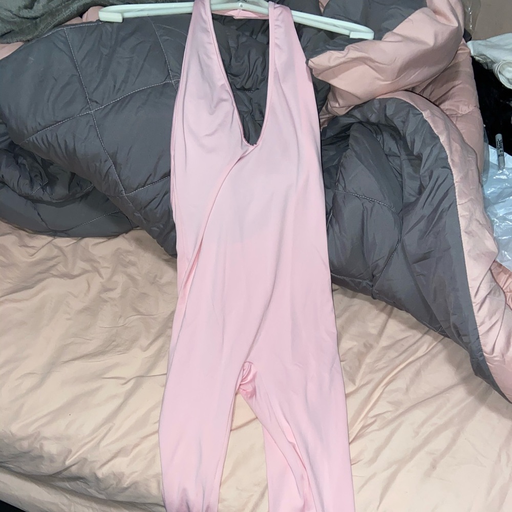 Baby pink jumpsuit one piece.
